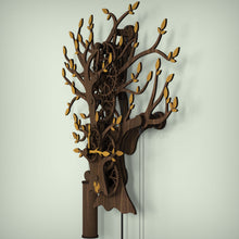 Load image into Gallery viewer, Tree Of Life wooden pendulum clock showing the depth of the clock and rear mounting frame