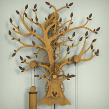 Load image into Gallery viewer, Tree Of Life wooden clock, mechanical gears with pendulum, wall mounted finished in oak with walnut leaves