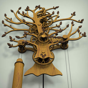 Oak with Walnut Leaves Tree Of Life wooden clock mechanism, underside view with drive weight