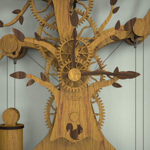 Tree Of Life wooden mechanical clock showing tree branch hour and minute hands finished in walnut