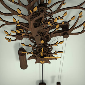 Tree Of Life wooden pendulum wall clock, top view showing wooden gear train and oak leaves